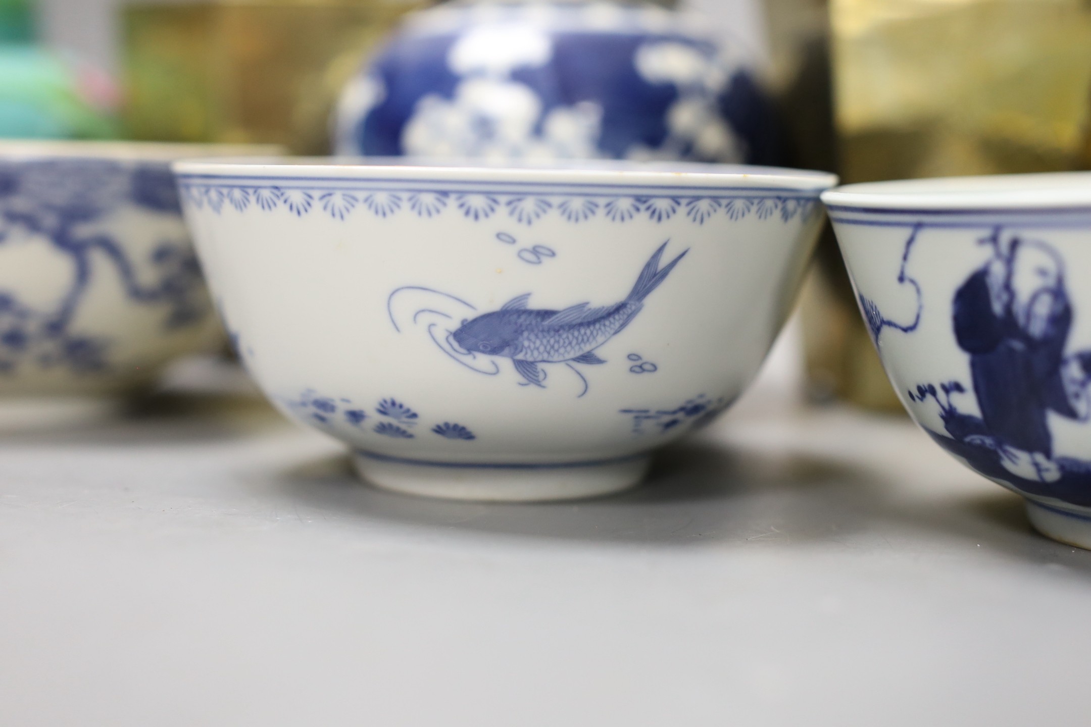 A Chinese brass tea caddy and kettle together with three similar blue and white porcelain bowls, three jars and covers and a Japanese vase